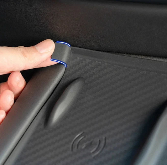 Hand holding a car seat cover with a small handle design, emphasizing ease of cleaning.